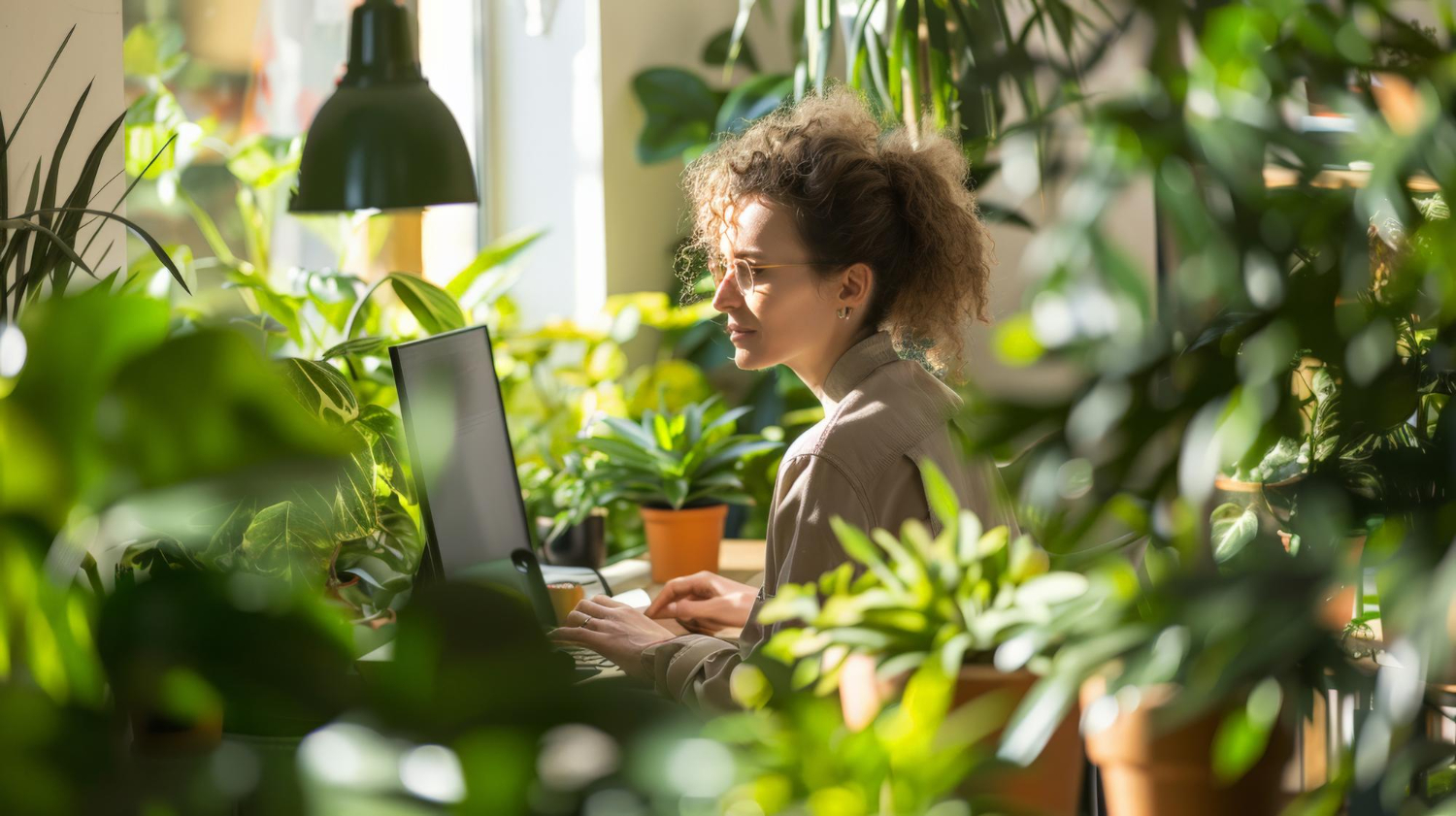 woman on computer plants